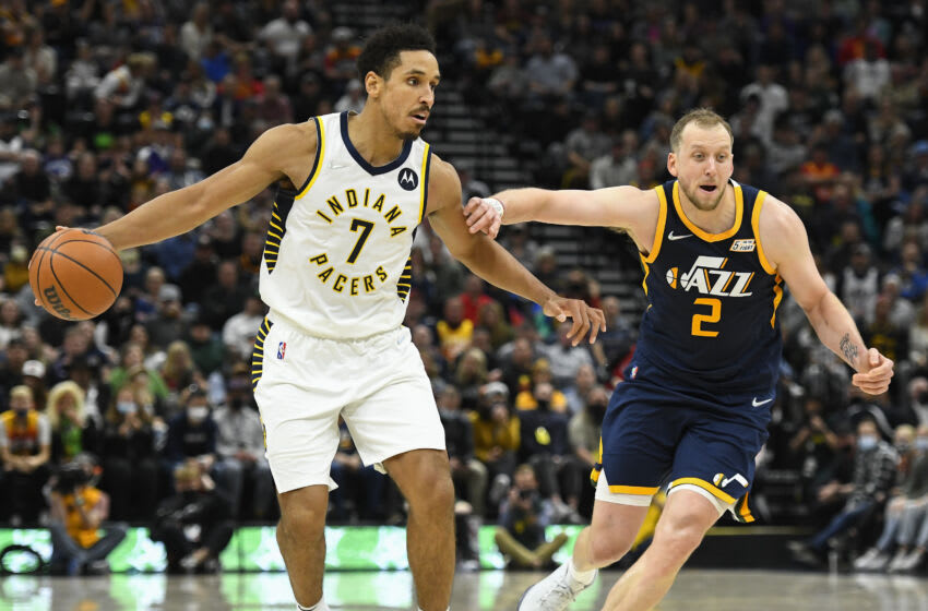 SALT LAKE CITY, UTAH - NOVEMBER 11: Malcolm Brogdon #7 of the Indiana Pacers drives past Joe Ingles #2 of the Utah Jazz during a game at Vivint Smart Home Arena on November 11, 2021 in Salt Lake City, Utah. NOTE TO USER: User expressly acknowledges and agrees that, by downloading and or using this photograph, User is consenting to the terms and conditions of the Getty Images License Agreement. (Photo by Alex Goodlett/Getty Images)