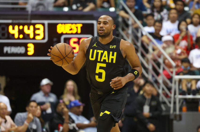 HONOLULU, HAWAII - OCTOBER 8: Talen Horton-Tucker #5 of the Utah Jazz brings the ball up court during the second half of the preseason game against the Los Angeles Clippers at SimpliFi Arena at the Stan Sheriff Center on October 8, 2023 in Honolulu, Hawaii. NOTE TO USER: User expressly acknowledges and agrees that, by downloading and or using this photograph, User is consenting to the terms and conditions of the Getty Images License Agreement. (Photo by Darryl Oumi/Getty Images)