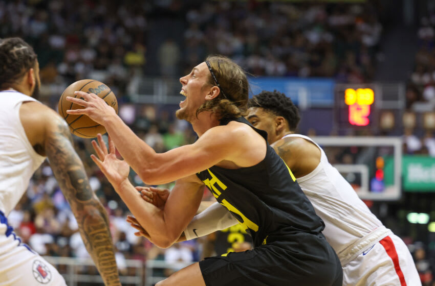 HONOLULU, HAWAII - OCTOBER 8: Kelly Olynyk #41 of the Utah Jazz reacts as he is fouled by Kenyon Martin #6 of the Los Angeles Clippers during the second half of the preseason game at SimpliFi Arena at the Stan Sheriff Center on October 8, 2023 in Honolulu, Hawaii. NOTE TO USER: User expressly acknowledges and agrees that, by downloading and or using this photograph, User is consenting to the terms and conditions of the Getty Images License Agreement. (Photo by Darryl Oumi/Getty Images)